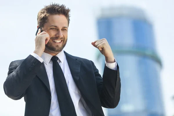 A next-generation leader speaking confidently by phone